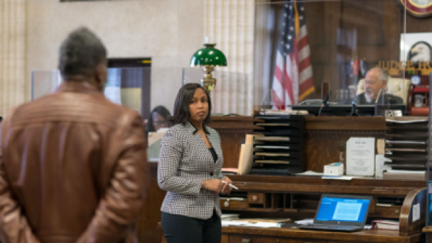A lawyer looks at a defendant